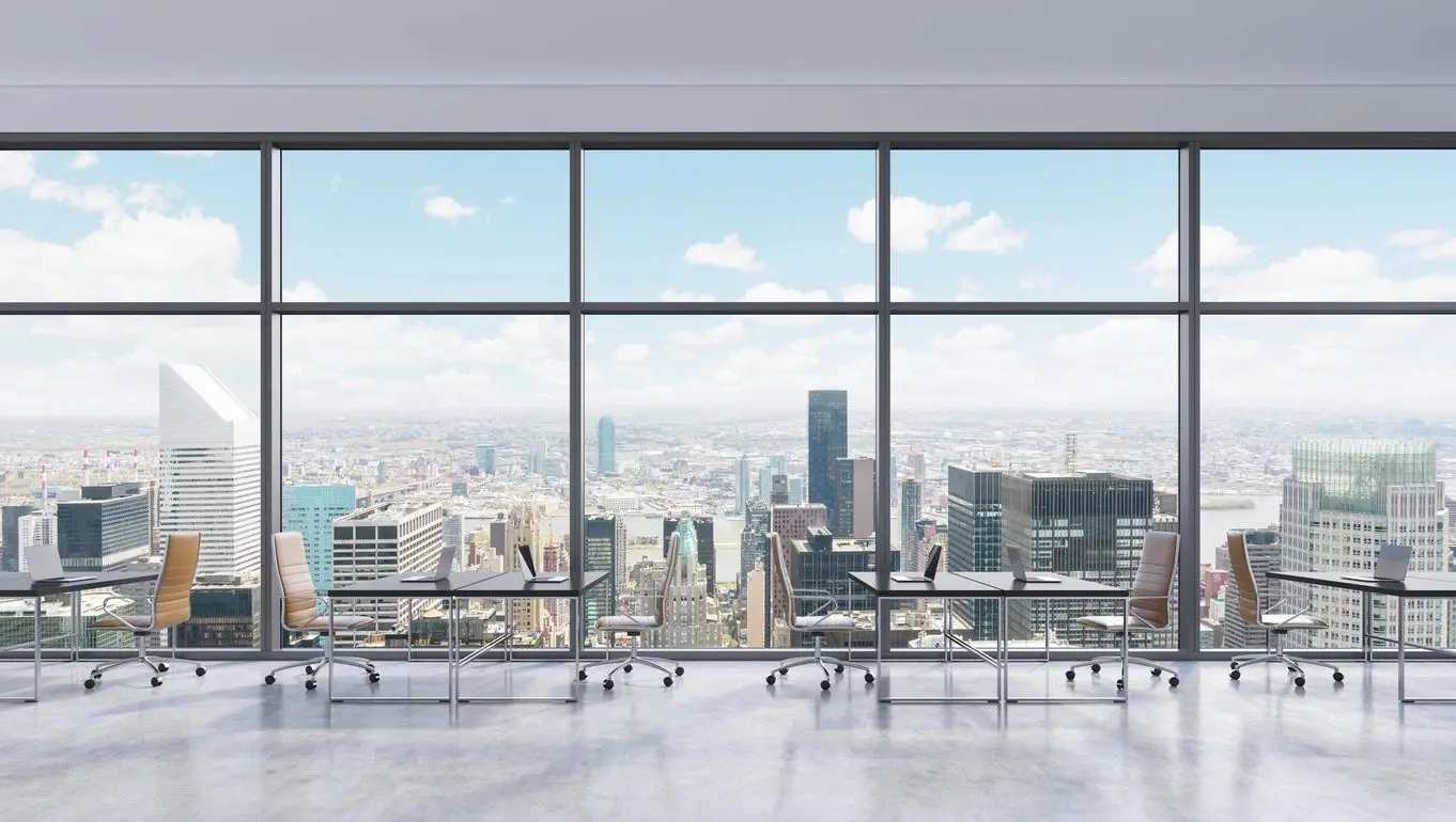 A large window overlooking the city skyline.